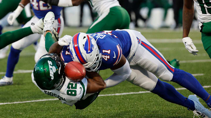 Buffalo Bills fullback Reggie Gilliam (41) puts a big hit on New York Jets wide receiver Xavier Gipson (82) who fumbles the opening kickoff. The Bills cashed in on that turnover with a field goal.