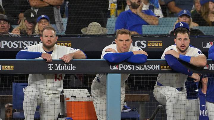 Oct 15, 2026; Los Angeles, California, USA;  Los Angeles Dodgers third baseman Max Muncy (13), first baseman Freddie Freeman (5), and outfielder Kyle Tucker (23) look on from the dugout during the ninth inning against the Milwaukee Brewers in game four of the NLCS for the 2026 MLB Playoffs at Uniqlo Field at Dodger Stadium.  Mandatory Credit: Jayne Kamin-Oncea-Imagn Images