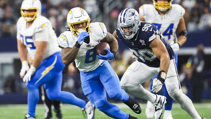 Dec 21, 2025; Arlington, Texas, USA; Los Angeles Chargers running back Omarion Hampton (8) rushes ahead of Dallas Cowboys defensive tackle Solomon Thomas (90) during the fourth quarter at AT&T Stadium. Mandatory Credit: Kevin Jairaj-Imagn Images