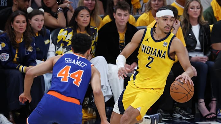 Indiana Pacers guard Andrew Nembhard (2) dribbles the ball against New York Knicks guard Landry Shamet (44) in thex fourth quarter during game six of the eastern conference finals for the 2025 NBA Playoffs at Gainbridge Fieldhouse.