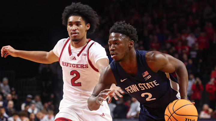Dec 10, 2024; Piscataway, New Jersey, USA; Penn State Nittany Lions guard D'Marco Dunn (2) drives to the basket against Rutgers Scarlet Knights guard Dylan Harper (2) during the first half at Jersey Mike's Arena. Mandatory Credit: Vincent Carchietta-Imagn Images