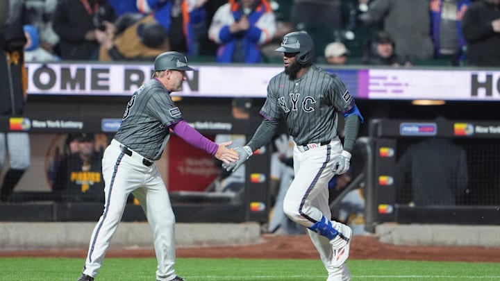 Mar 28, 2026; New York City, New York, USA; New York Mets third base coach Tim Leiper (63) congratulates New York Mets center fielder Luis Robert Jr. (88) for hitting a walk off three run home run against the Pittsburgh Pirates during the eleventh inning at Citi Field. Mandatory Credit: Gregory Fisher-Imagn Images