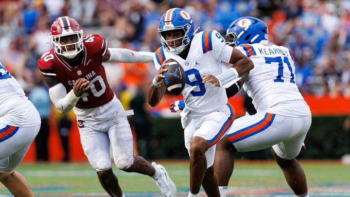 Oct 10, 2026; Gainesville, Florida, USA;  Florida Gators quarterback Tramell Jones Jr. (9) runs with the ball while South Carolina Gamecocks edge Anthony Addison (40) chases \d2h at Ben Hill Griffin Stadium.  Mandatory Credit: Matt Pendleton-Imagn Images