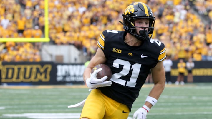 Iowa’s Kaden Wetjen (21) runs with the ball against Troy Saturday, Sept. 14, 2024 at Kinnick Stadium in Iowa City, Iowa.