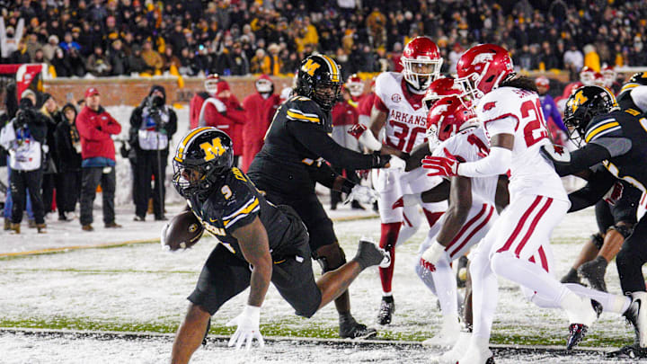 Nov 30, 2024; Columbia, Missouri, USA; Missouri Tigers running back Marcus Carroll (9) scores a touchdown against the Arkansas Razorbacks during the second half at Faurot Field at Memorial Stadium. Mandatory Credit: Denny Medley-Imagn Images