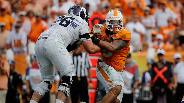 Jan 1, 2016; Tampa, FL, USA; Tennessee Volunteers defensive end Derek Barnett (9) rushes past Northwestern Wildcats offensive lineman Eric Olson (76) during the first half in the 2016 Outback Bowl at Raymond James Stadium. Mandatory Credit: Kim Klement-USA TODAY Sports Jan 1, 2016; Tampa, FL, USA; Tennessee Volunteers defensive end Derek Barnett (9) rushes past Northwestern Wildcats offensive lineman Eric Olson (76) during the first half in the 2016 Outback Bowl at Raymond James Stadium. Mandatory Credit: Kim Klement-USA TODAY Sports