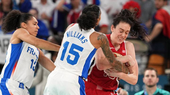 Aug 11, 2024; Paris, France; United States power forward Breanna Stewart (10) fights for possession against France forward Gabby Williams (15) and forward Janelle Salaun (13) in the second half in the women's gold medal game during the Paris 2024 Olympic Summer Games at Accor Arena. Mandatory Credit: James Lang-USA TODAY Sports