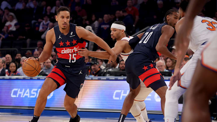 Nov 18, 2024; New York, New York, USA; Washington Wizards guard Malcolm Brogdon (15) controls the ball against New York Knicks guard Josh Hart (3) during the first quarter at Madison Square Garden. Mandatory Credit: Brad Penner-Imagn Images
