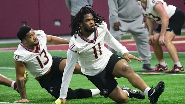 Florida State football players Sione Lolohea (13) and Patrick Payton (11) take part in the final Tour of Duty winter workouts ahead of 2024 spring practices on Thursday, March 7, 2024.
