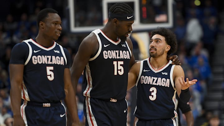 Gonzaga Bulldogs forward Emmanuel Innocenti (5), forward Graham Ike (15), and guard Braeden Smith (3) walk back to the bench against the Kentucky Wildcats during the first half at Bridgestone Arena. Gonzaga Bulldogs forward Emmanuel Innocenti (5), forward Graham Ike (15), and guard Braeden Smith (3) walk back to the bench against the Kentucky Wildcats during the first half at Bridgestone Arena.