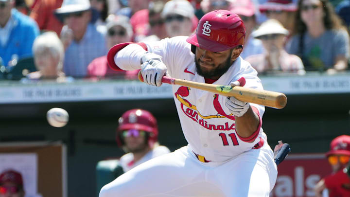 Mar 12, 2025; Jupiter, Florida, USA; St. Louis Cardinals outfielder Victor Scott II (11) tries to bunt in the third inning against the New York Mets at Roger Dean Chevrolet Stadium. Mandatory Credit: Jim Rassol-Imagn Images Mar 12, 2025; Jupiter, Florida, USA; St. Louis Cardinals outfielder Victor Scott II (11) tries to bunt in the third inning against the New York Mets at Roger Dean Chevrolet Stadium. Mandatory Credit: Jim Rassol-Imagn Images