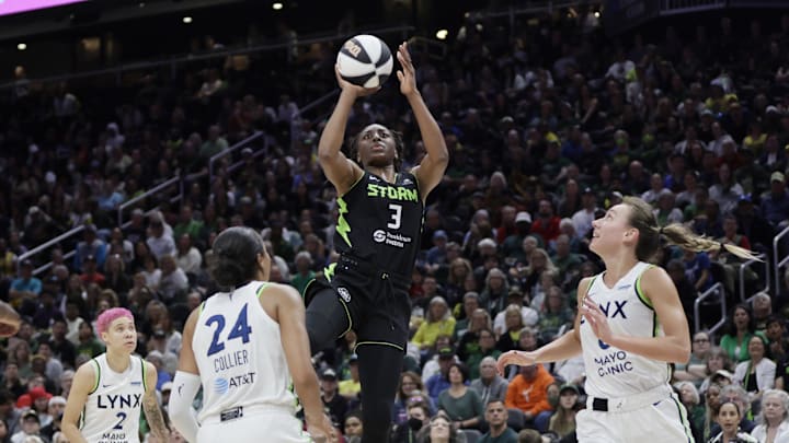 Jun 11, 2025; Seattle, Washington, USA; Seattle Storm forward Nneka Ogwumike (3) shoots with Minnesota Lynx guard Natisha Hiedeman (2), forward Napheesa Collier (24) and forward Alanna Smith (8) defending during the first half at Climate Pledge Arena. 
