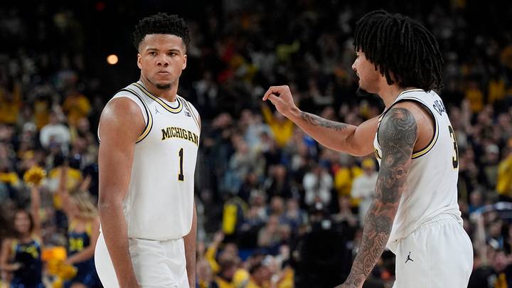 Michigan guards Trey McKenney (1) and Elliot Cadeau (3) react to a play during the second half of the NCAA national championship game against Connecticut at Lucas Oil Stadium in Indianapolis on Monday, April 6, 2026.