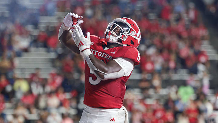 Aug 29, 2024; Piscataway, New Jersey, USA;  Rutgers Scarlet Knights running back Kyle Monangai (5) celebrates after a touchdown during the second half against the Howard Bison at SHI Stadium. Mandatory Credit: Vincent Carchietta-Imagn Images