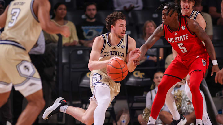 Mar 1, 2025; Atlanta, Georgia, USA; Georgia Tech Yellow Jackets guard Lance Terry (0) drives to the basket against the North Carolina State Wolfpack in the first half at McCamish Pavilion. Mandatory Credit: Brett Davis-Imagn Images