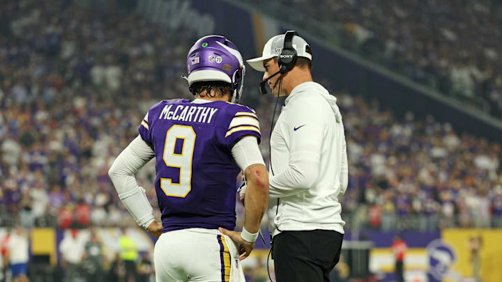 Sep 14, 2025; Minneapolis, Minnesota, USA; Minnesota Vikings quarterback J.J. McCarthy (9) speaks with Minnesota Vikings head coach Kevin O'Connell during the first half against the Atlanta Falcons at U.S. Bank Stadium. Mandatory Credit: Matt Krohn-Imagn Images Sep 14, 2025; Minneapolis, Minnesota, USA; Minnesota Vikings quarterback J.J. McCarthy (9) speaks with Minnesota Vikings head coach Kevin O'Connell during the first half against the Atlanta Falcons at U.S. Bank Stadium. Mandatory Credit: Matt Krohn-Imagn Images