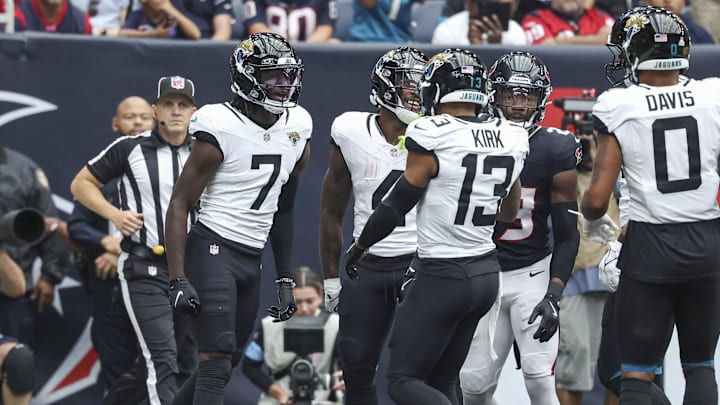 Sep 29, 2024; Houston, Texas, USA; Jacksonville Jaguars wide receiver Brian Thomas Jr. (7) celebrates with teammates after scoring a touchdown during the first quarter against the Houston Texans at NRG Stadium. Mandatory Credit: Troy Taormina-Imagn Images
