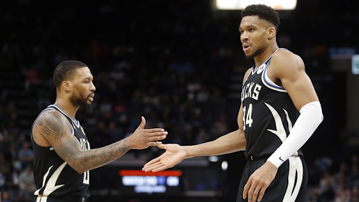 Feb 15, 2024; Memphis, Tennessee, USA; Milwaukee Bucks guard Damian Lillard (0) and Milwaukee Bucks