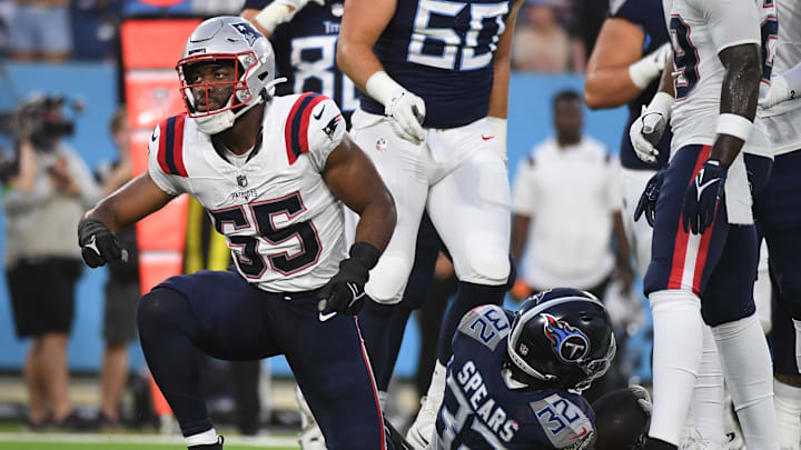 New England Patriots linebacker Josh Uche (55) tackles Tennessee Titans running back Tyjae Spears (32) for a loss during the first half at Nissan Stadium during the 2023 season.