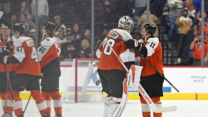 Oct 18, 2025; Philadelphia, Pennsylvania, USA; Philadelphia Flyers goaltender Dan Vladar (80) and right wing Travis Konecny (11) celebrate win in overtime against the Minnesota Wild at Wells Fargo Center. Mandatory Credit: Eric Hartline-Imagn Images