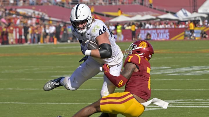 Penn State Nittany Lions tight end Tyler Warren (44) is stopped by USC Trojans safety Kamari Ramsey (7) after a short gain in the second half at United Airlines Field at the Los Angeles Memorial Coliseum. Penn State Nittany Lions tight end Tyler Warren (44) is stopped by USC Trojans safety Kamari Ramsey (7) after a short gain in the second half at United Airlines Field at the Los Angeles Memorial Coliseum.