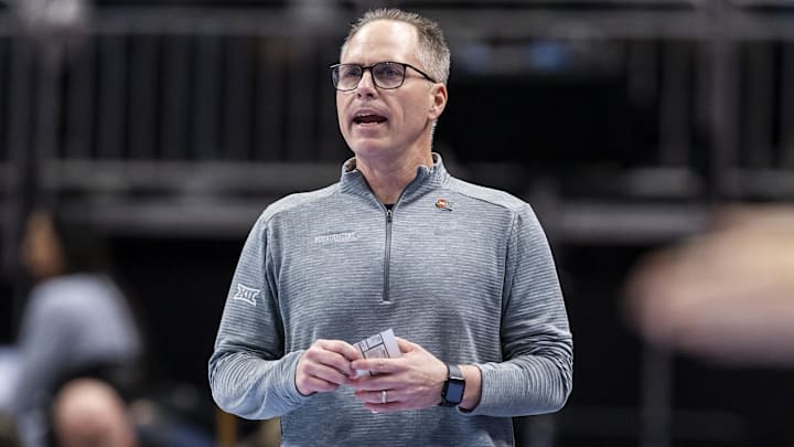 Mar 6, 2026; Kansas City, MO, USA; West Virginia head coach Mark Kellogg watches the run of play against Arizona State during the first half at T-Mobile Center. Mandatory Credit: Nick Tre. Smith-Imagn Images
