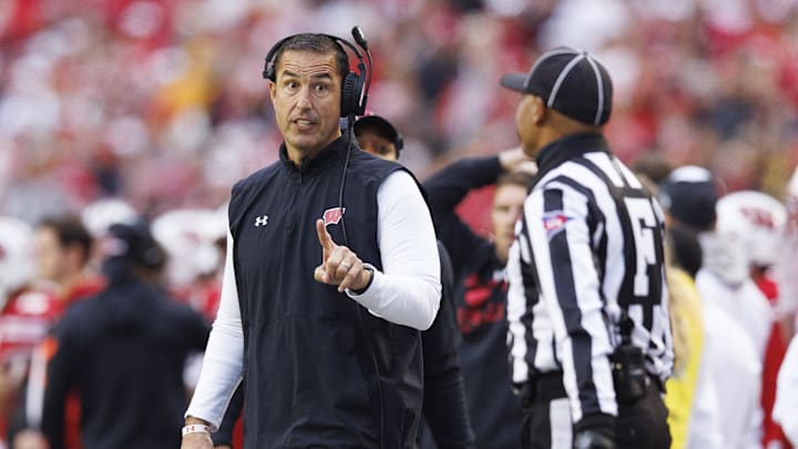 Oct 14, 2023; Madison, Wisconsin, USA;  Wisconsin Badgers head coach Luke  Fickell talks with an official during the third quarter against the Iowa Hawkeyes at Camp Randall Stadium. Mandatory Credit: Jeff Hanisch-Imagn Images