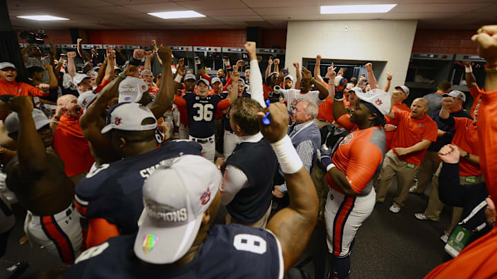 Dec 7, 2013; Atlanta, GA, USA; Auburn Tigers celebrate their win over the Missouri Tigers as sing