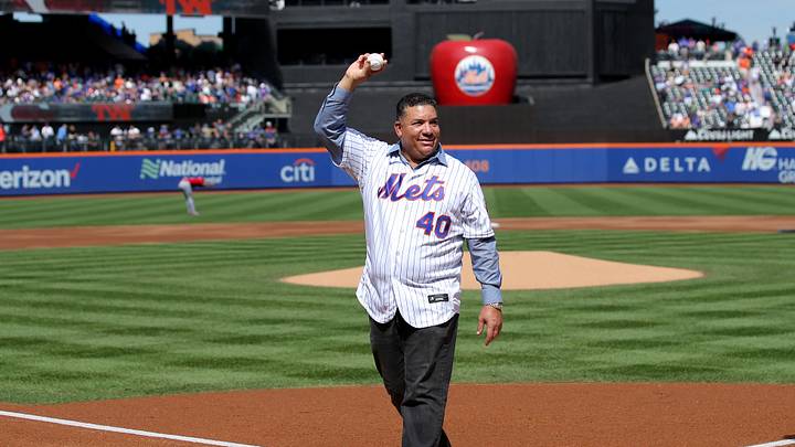 Sep 17, 2023; New York City, New York, USA; New York Mets former pitcher Bartolo Colon waves after throwing out a ceremonial first pitch before a game against the Cincinnati Reds at Citi Field. Colon today retired from baseball as a Met. Mandatory Credit: Brad Penner-Imagn Images