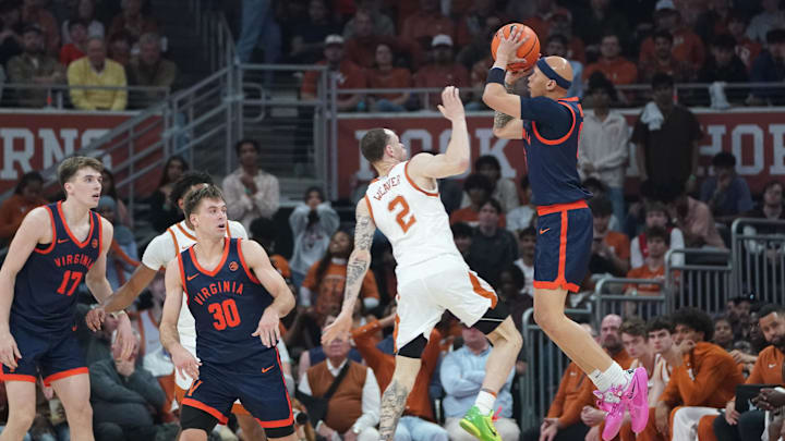 Dec 3, 2025; Austin, Texas, USA; Virginia Cavaliers guard Jacari White (6) shoots a three point basket against Texas Longhorns guard Chendall Weaver (2) during the first half at Moody Center. Mandatory Credit: Dustin Safranek-Imagn Images