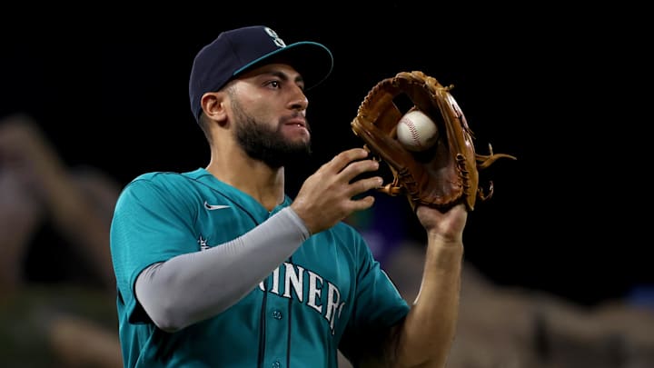 Seattle Mariners third baseman Abraham Toro (13) catches a foul fly during the fourth inning against the Los Angeles Angels at Angel Stadium in 2022.