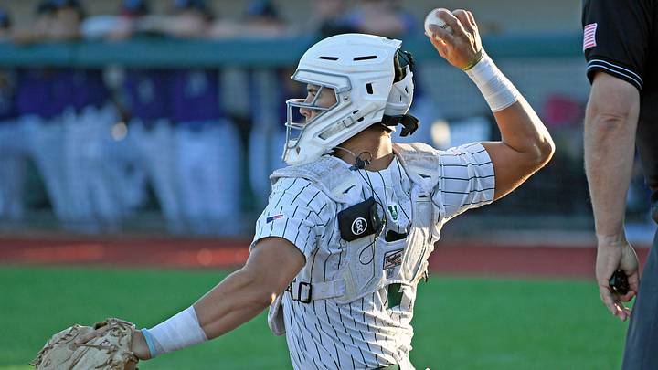 Venice's catcher Jon Embury wearing the one-way communication device during the game.