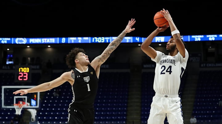 Nov 20, 2024; University Park, Pennsylvania, USA; Penn State Nittany Lions forward Zach Hicks (24) shoots the ball as Purdue Fort Wayne Mastodons guard Jalen Jackson (1) defends during the first half at Bryce Jordan Center. Mandatory Credit: Matthew O'Haren-Imagn Images