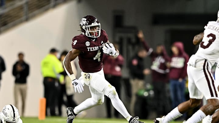 Nov 11, 2023; College Station, Texas, USA; Texas A&M Aggies running back Amari Daniels (4) runs the ball during the second quarter against the Mississippi State Bulldogs at Kyle Field. Mandatory Credit: Maria Lysaker-Imagn Images