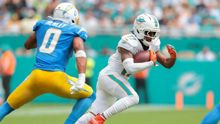 Miami Dolphins wide receiver Jaylen Waddle (17) carries the football against Los Angeles Chargers linebacker Daiyan Henley (0) during the second quarter at Hard Rock Stadium. Miami Dolphins wide receiver Jaylen Waddle (17) carries the football against Los Angeles Chargers linebacker Daiyan Henley (0) during the second quarter at Hard Rock Stadium.