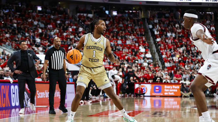 Jan 17, 2026; Raleigh, North Carolina, USA; Georgia Tech Yellow Jackets guard Lamar Washington (1) dribbles with the ball during the second half of the game against the NC State Wolfpack  at Lenovo Center. Mandatory Credit: Jaylynn Nash-Imagn Images