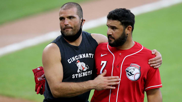 Cincinnati Reds first baseman Joey Votto, left, and third baseman Eugenio Suárez embrace at the conclusion of an intrasquad scrimmage on July 15 at Great American Ball Park.
 Kareem Elgazzar
Cincinnati Reds first baseman Joey Votto (19) and Cincinnati Reds third baseman Eugenio Suarez (7) embrace at the conclusion of an intrasquad scrimmage, Wednesday, July 15, 2020, at Great American Ball Park in Cincinnati.