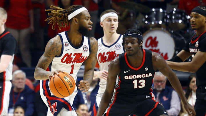 Jan 4, 2025; Oxford, Mississippi, USA; Mississippi Rebels forward Mikeal Brown-Jones (1) dribbles as Georgia Bulldogs forward Dylan James (13) defends during the first half at The Sandy and John Black Pavilion at Ole Miss. Mandatory Credit: Petre Thomas-Imagn Images Jan 4, 2025; Oxford, Mississippi, USA; Mississippi Rebels forward Mikeal Brown-Jones (1) dribbles as Georgia Bulldogs forward Dylan James (13) defends during the first half at The Sandy and John Black Pavilion at Ole Miss. Mandatory Credit: Petre Thomas-Imagn Images