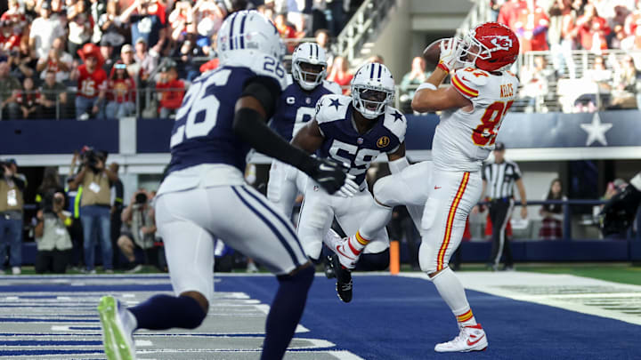 Nov 27, 2025; Arlington, Texas, USA; Kansas City Chiefs tight end Travis Kelce (87) catches a pass for a touchdown against Dallas Cowboys linebacker Kenneth Murray Jr. (59) during the first quarter at AT&T Stadium. Mandatory Credit: Kevin Jairaj-Imagn Images Nov 27, 2025; Arlington, Texas, USA; Kansas City Chiefs tight end Travis Kelce (87) catches a pass for a touchdown against Dallas Cowboys linebacker Kenneth Murray Jr. (59) during the first quarter at AT&T Stadium. Mandatory Credit: Kevin Jairaj-Imagn Images