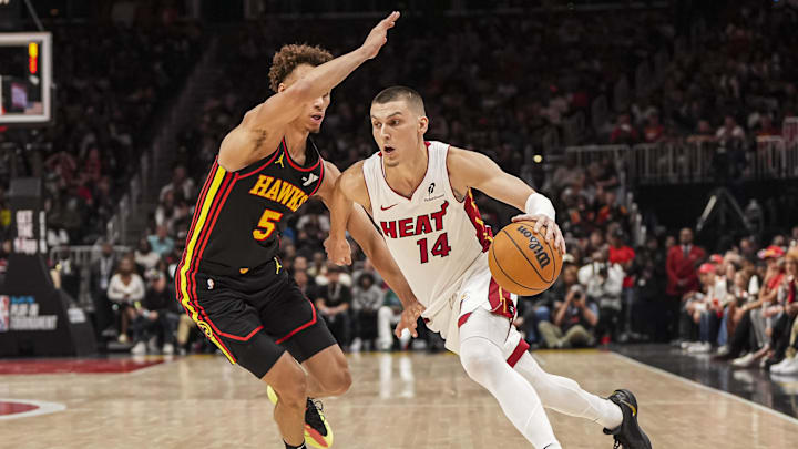 Apr 18, 2025; Atlanta, Georgia, USA; Miami Heat guard Tyler Herro (14) dribbles past Atlanta Hawks guard Dyson Daniels (5) during the second half at State Farm Arena. Mandatory Credit: Dale Zanine-Imagn Images Apr 18, 2025; Atlanta, Georgia, USA; Miami Heat guard Tyler Herro (14) dribbles past Atlanta Hawks guard Dyson Daniels (5) during the second half at State Farm Arena. Mandatory Credit: Dale Zanine-Imagn Images