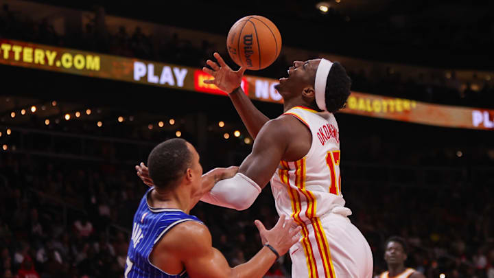 Nov 4, 2025; Atlanta, Georgia, USA; Orlando Magic guard Desmond Bane (3) fouls Atlanta Hawks forward Onyeka Okongwu (17) in the third quarter at State Farm Arena. Mandatory Credit: Brett Davis-Imagn Images