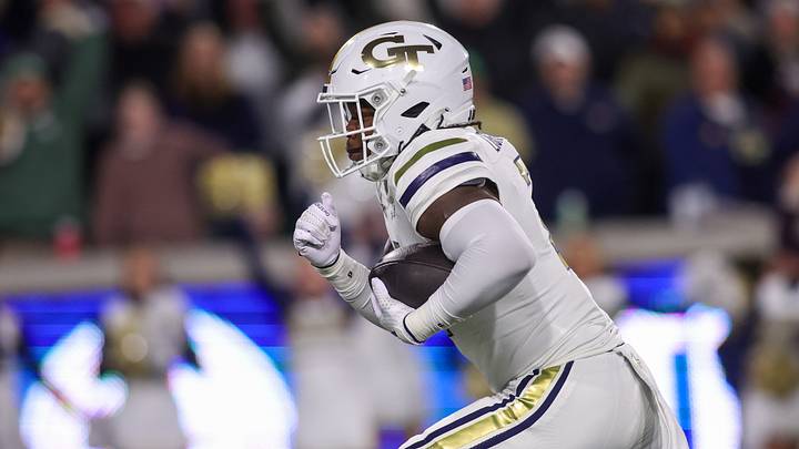 Nov 21, 2024; Atlanta, Georgia, USA; Georgia Tech Yellow Jackets linebacker E.J. Lightsey (2) returns an interception for a touchdown against the North Carolina State Wolfpack in the first quarter at Bobby Dodd Stadium at Hyundai Field. Mandatory Credit: Brett Davis-Imagn Images