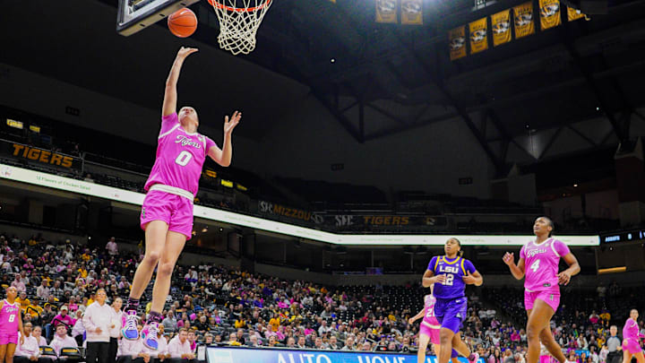 Feb 6, 2025; Columbia, Missouri, USA; Missouri Tigers guard Grace Slaughter (0) shoots a layup against the LSU Lady Tigers during the second half at Mizzou Arena. Mandatory Credit: Denny Medley-Imagn Images