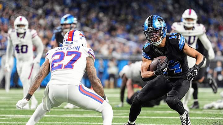 Detroit Lions wide receiver Amon-Ra St. Brown (14) runs against Buffalo Bills safety Kareem Jackson (27) during the second half at Ford Field in Detroit on Sunday, Dec. 15, 2024.