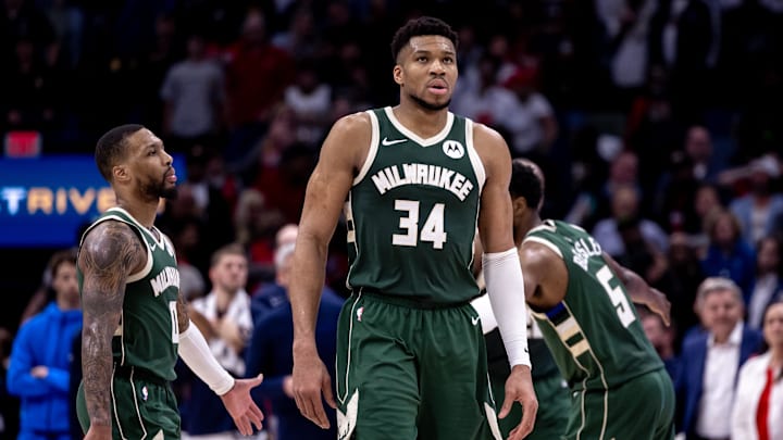 Mar 28, 2024; New Orleans, Louisiana, USA;   Milwaukee Bucks forward Giannis Antetokounmpo (34) and guard Damian Lillard (0) head to the bench on a timer out against the New Orleans Pelicans during the second half at Smoothie King Center. Mandatory Credit: Stephen Lew-Imagn Images