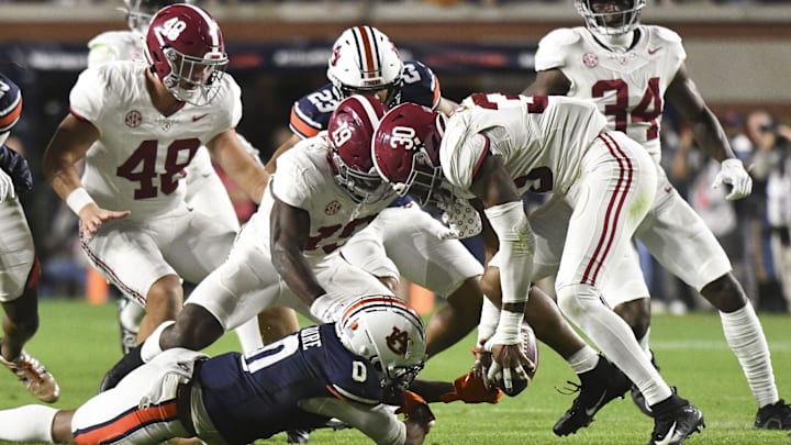 Nov 25, 2023; Auburn, Alabama, USA;  Alabama Crimson Tide linebacker Jihaad Campbell (30) recovers a