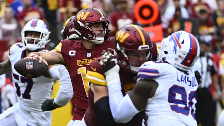 Sep 24, 2023; Landover, Maryland, USA; Washington Commanders quarterback Sam Howell (14) drops back