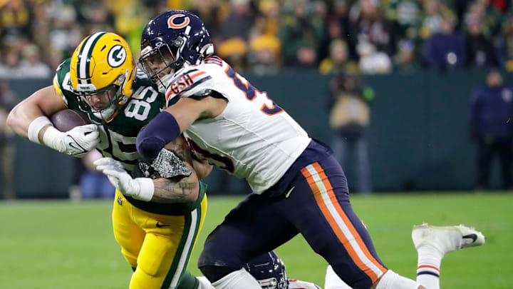 Bears linebacker T.J. Edwards puts a hit on Packers tight end Tucker Kraft in Lambeau Field last season, a 17-9 Green Bay win.