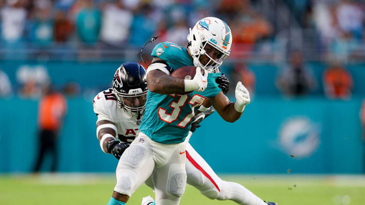 Aug 11, 2023; Miami Gardens, Florida, USA; Miami Dolphins running back Myles Gaskin (37) breaks a tackle from Atlanta Falcons linebacker Tae Davis (50) in the second quarter at Hard Rock Stadium. Mandatory Credit: Nathan Ray Seebeck-Imagn Images Aug 11, 2023; Miami Gardens, Florida, USA; Miami Dolphins running back Myles Gaskin (37) breaks a tackle from Atlanta Falcons linebacker Tae Davis (50) in the second quarter at Hard Rock Stadium. Mandatory Credit: Nathan Ray Seebeck-Imagn Images