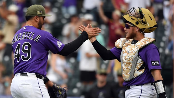 May 16, 2026; Denver, Colorado, USA; Colorado Rockies pitcher Antonio Senzatela (49) and Colorado Rockies catcher Hunter Goodman (15) celebrate after a win against the Arizona Diamondbacks at Coors Field. Mandatory Credit: Christopher Hanewinckel-Imagn Images